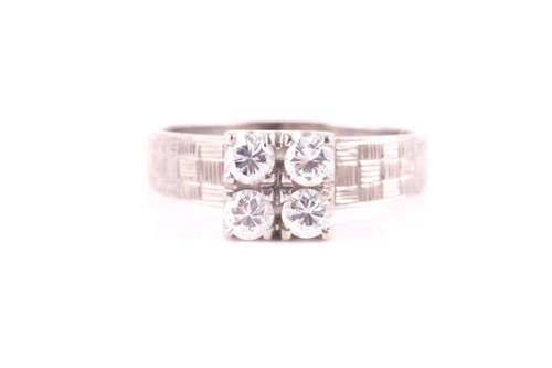 Lot 54 - A four stone diamond ring, the round brilliant...