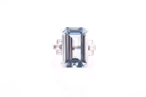 Lot 101 - A aquamarine and diamond dress ring, set with...
