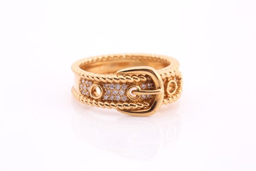 Lot 175 - A diamond-set buckle ring in yellow metal,...