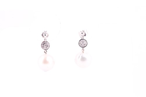 Lot 298 - A pair of diamond and pearl drop earrings, set...
