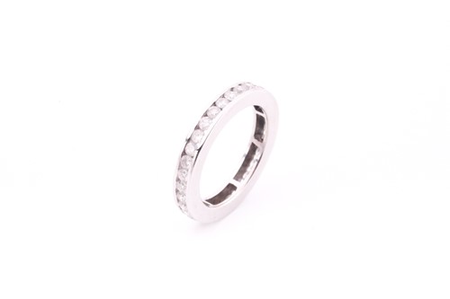 Lot 87 - A full eternity diamond set ring, channel set...