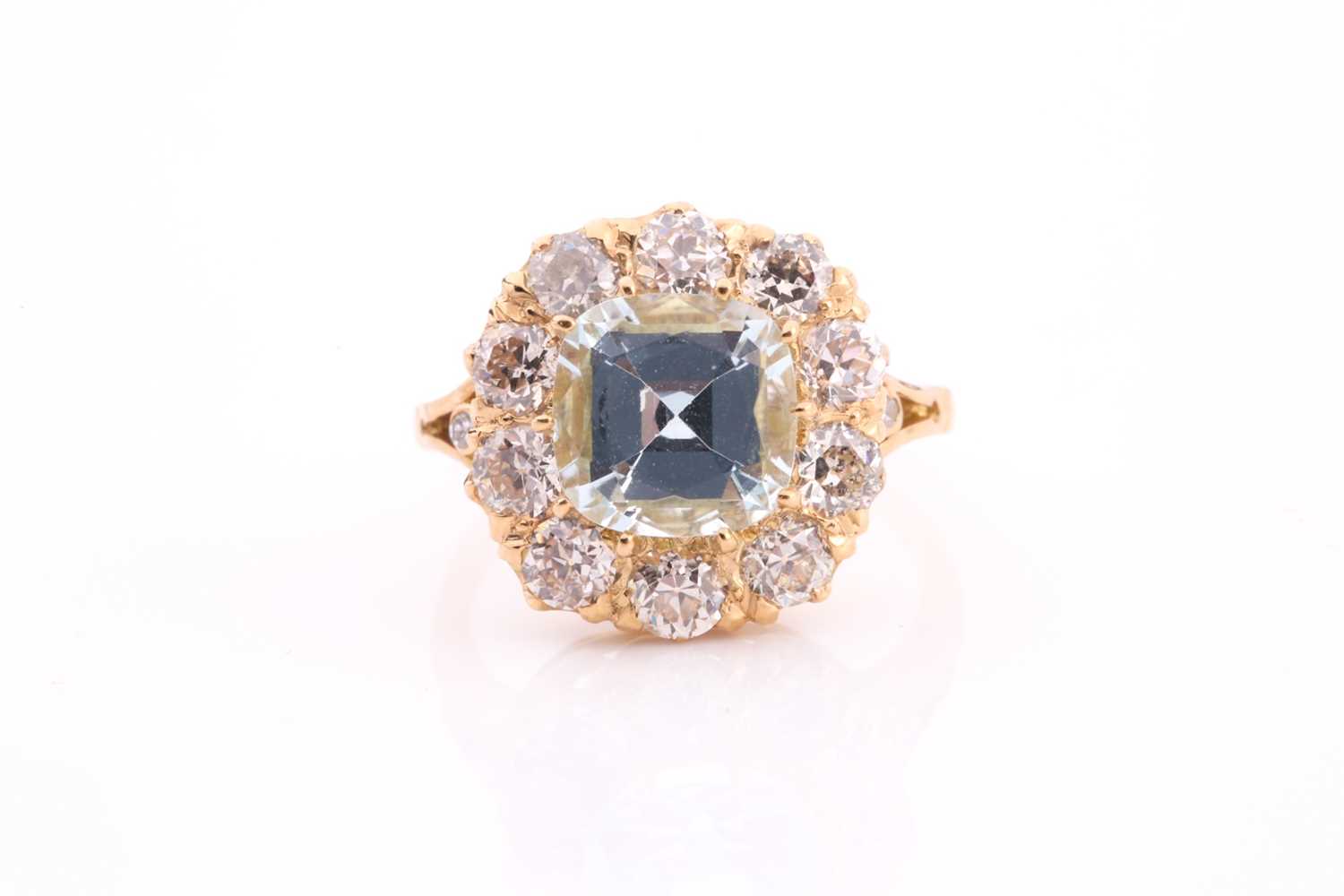 Lot 70 - An aquamarine and diamond cluster ring, set...
