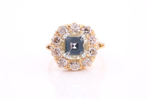 Lot 70 - An aquamarine and diamond cluster ring, set...