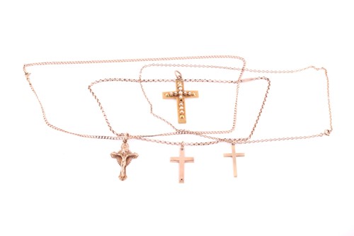 Lot 46 - A collection of three 9ct gold crosses,...