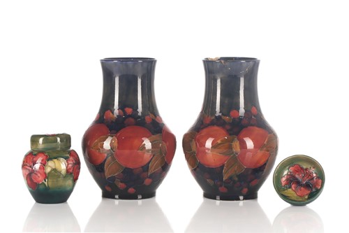 Lot 525 - A pair of Moorcroft Pomegranate pattern...