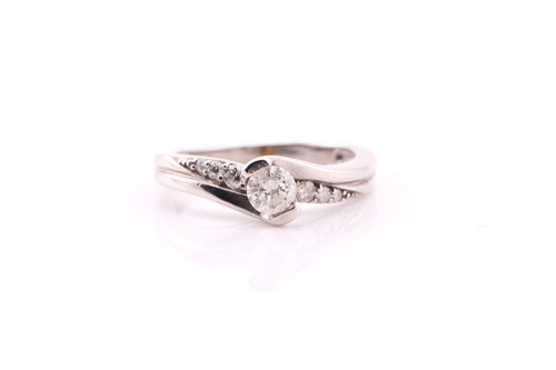 Lot 140 - A single stone diamond ring; the round...