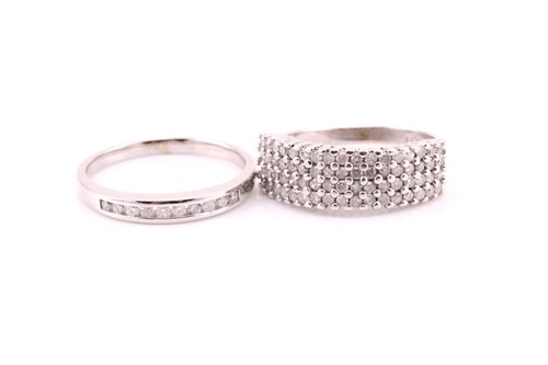Lot 178 - A four-row diamond ring; the round brilliant...