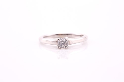 Lot 74 - A single stone diamond ring; the round...