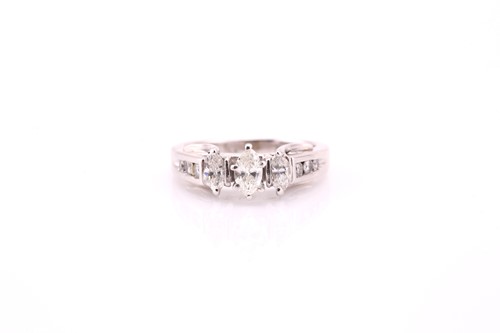 Lot 6 - A thee stone half hoop diamond ring, the...