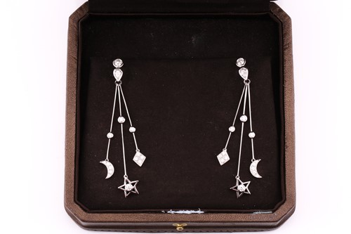 Lot 836 - A pair of diamond pendant earrings; the round...