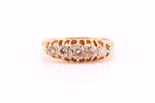 Lot 384 - An Edwardian graduated five stone half hoop...
