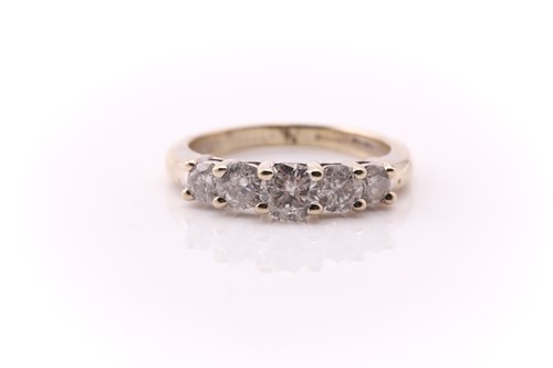 Lot 391 - A five stone half hoop diamond ring; the...