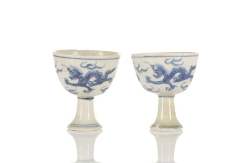 Lot 201 - A pair of Chinese blue & white stem cups, Ming...