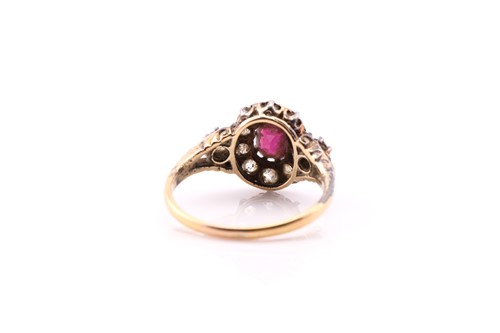 Lot 135 - A late Victorian ruby and diamond cluster ring;...