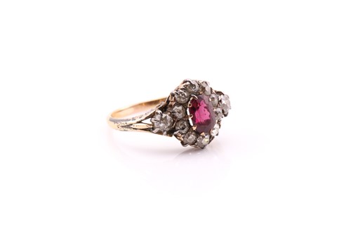 Lot 135 - A late Victorian ruby and diamond cluster ring;...