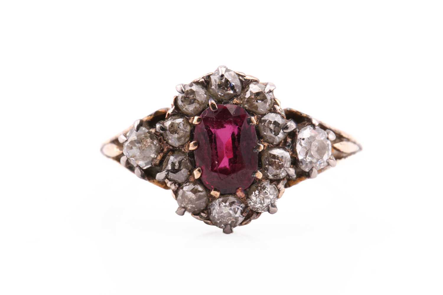 Lot 135 - A late Victorian ruby and diamond cluster ring;...