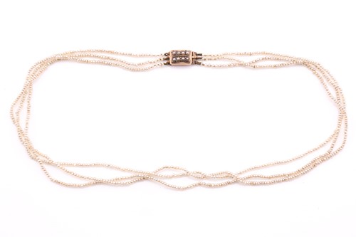 Lot 50 - A 19th century three-strand seed pearl...