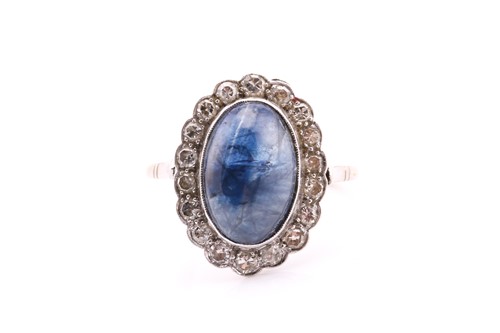Lot 180 - A white metal cluster ring consisting of an...