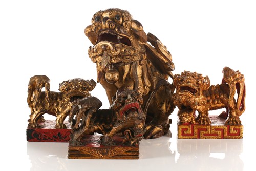Lot 156 - A large carved and gilded wood temple lion,...