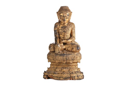 Lot 154 - A carved, lacquered and gilt wood figure of...