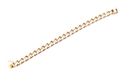 Lot 284 - A yellow metal stamped 585 curb link bracelet,...
