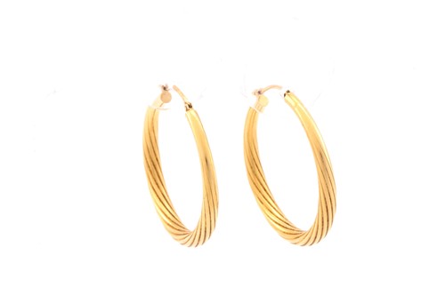 Lot 111 - A pair of 18carat gold hoop earrings of...