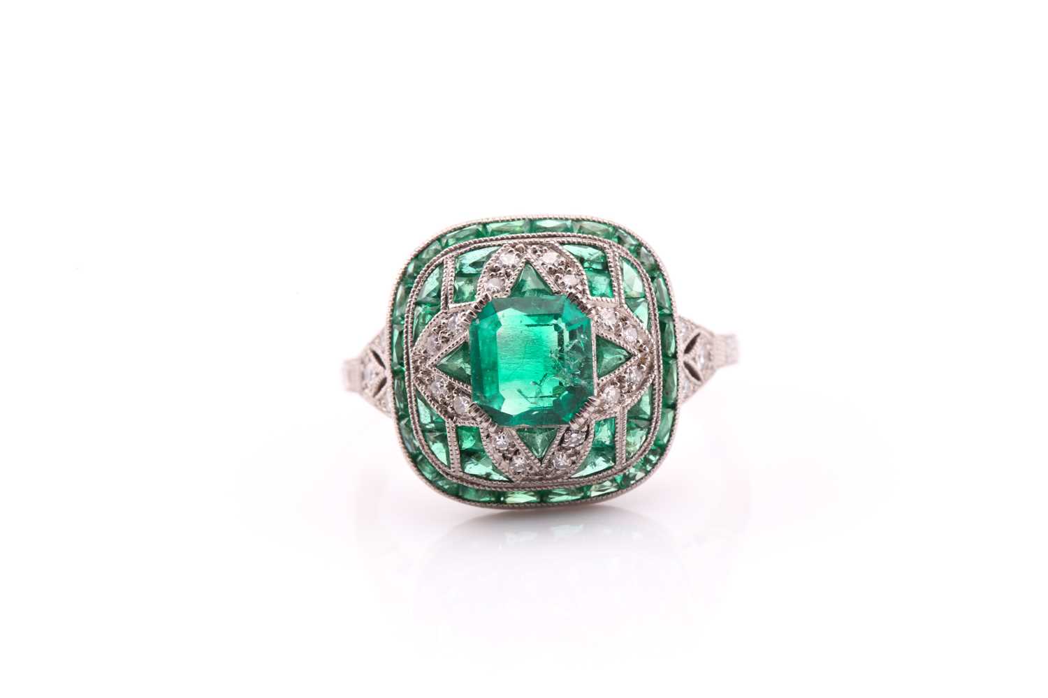 Lot 125 - An Art Deco style emerald and diamond ring,...