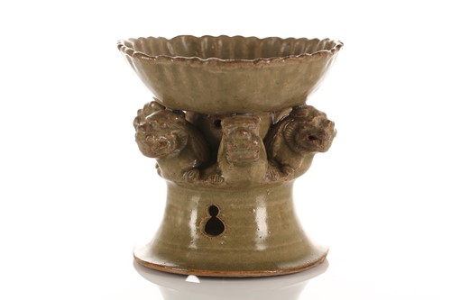 Lot 140 - A celadon bowl on integral stand, Ming/Qing,...