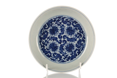 Lot 135 - A Chinese blue & white lotus dish, Qing, the...