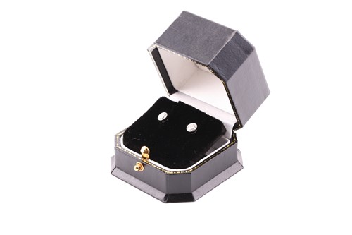 Lot 225 - A pair of diamond set stud earrings, in white...