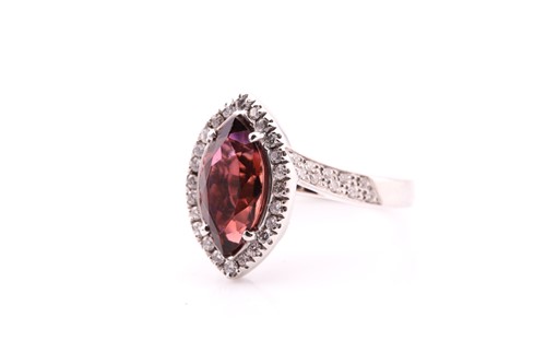 Lot 70 - A tourmaline and diamond cluster ring; the...