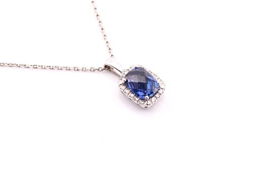Lot 10 - A white metal pendant and chain stamped 9ct...