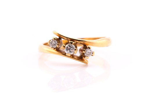 Lot 128 - An 18carat gold three stone diamond ring, the...