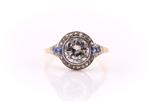 Lot 201 - A yellow and white metal halo ring, set with a...