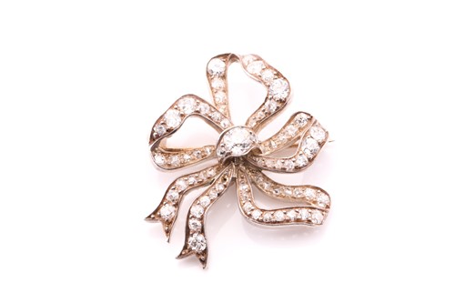 Lot 281 - A Victorian white metal bow brooch set with...