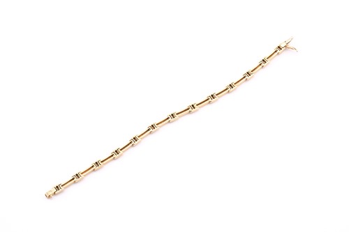 Lot 118 - A yellow precious metal and diamond link...