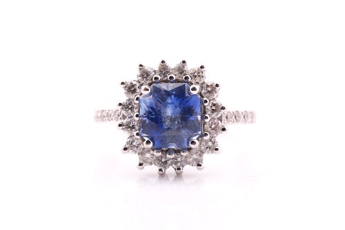 Lot 2 - A sapphire and diamond cluster ring, the...