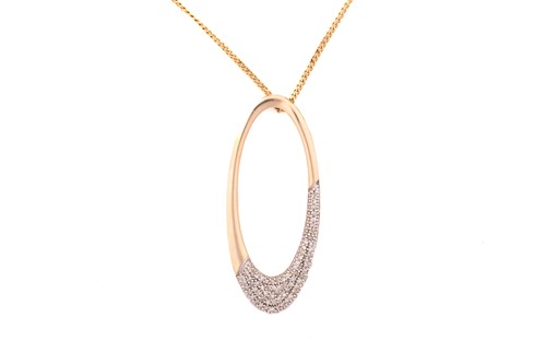 Lot 27 - A 9ct yellow gold oval pendant on chain, the...