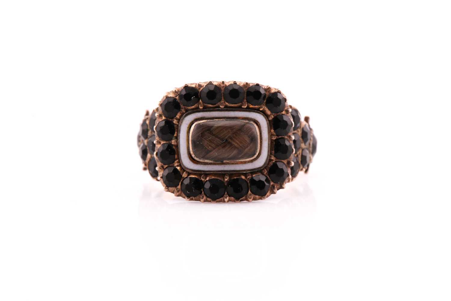 Lot 311 - A Georgian stone set mourning ring consisting...