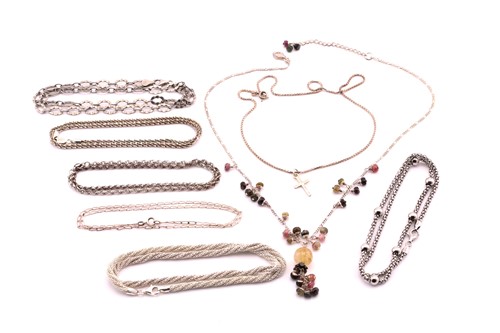 Lot 388 - Seven white metal chains and another gem-set...