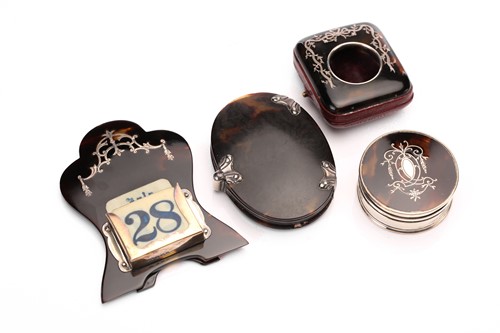 Lot 490 - An Edwardian silver inlaid tortoiseshell easel...