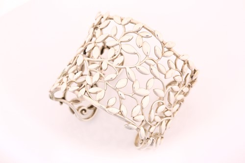 Lot 202 - TIFFANY & CO. - A silver 'Olive Leaf' cuff...