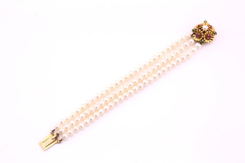 Lot 55 - A cultured pearl and gem-set bracelet; the...