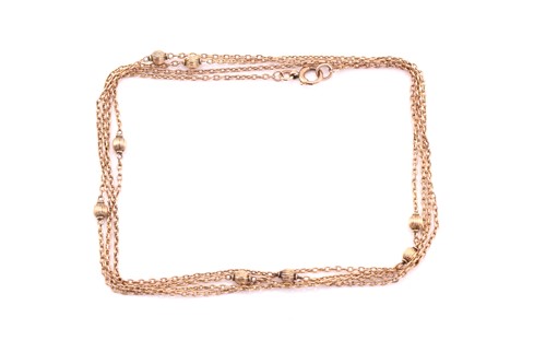 Lot 353 - An oval belcher and ball long chain,...