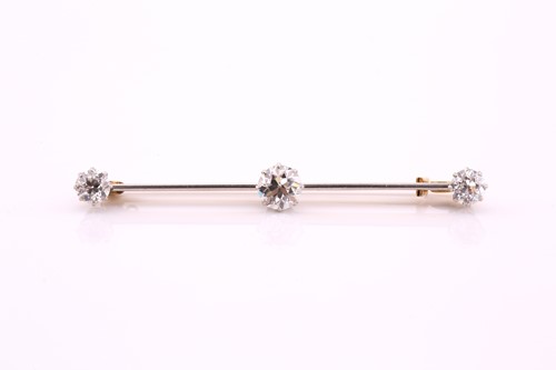 Lot 220 - A three-stone old cut diamond set bar brooch,...