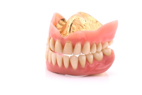 Lot 44 - Pair of false teeth with gold content, 53.8...