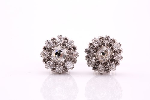 Lot 40 - Pair of diamond cluster earrings, each centred...