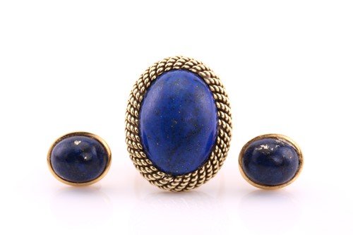 Lot 146 - A lapis lazuli dress ring, the oval lapis...