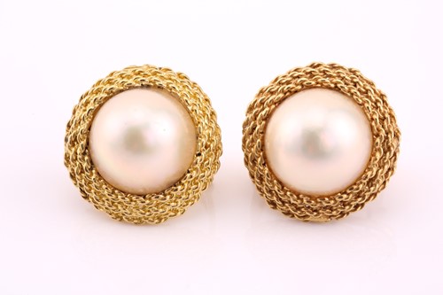 Lot 433 - Pair of Mabe pearl earrings, each centred by a...
