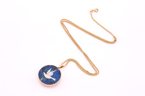 Lot 111 - A disc shape pendant, the hardstone mosaic...